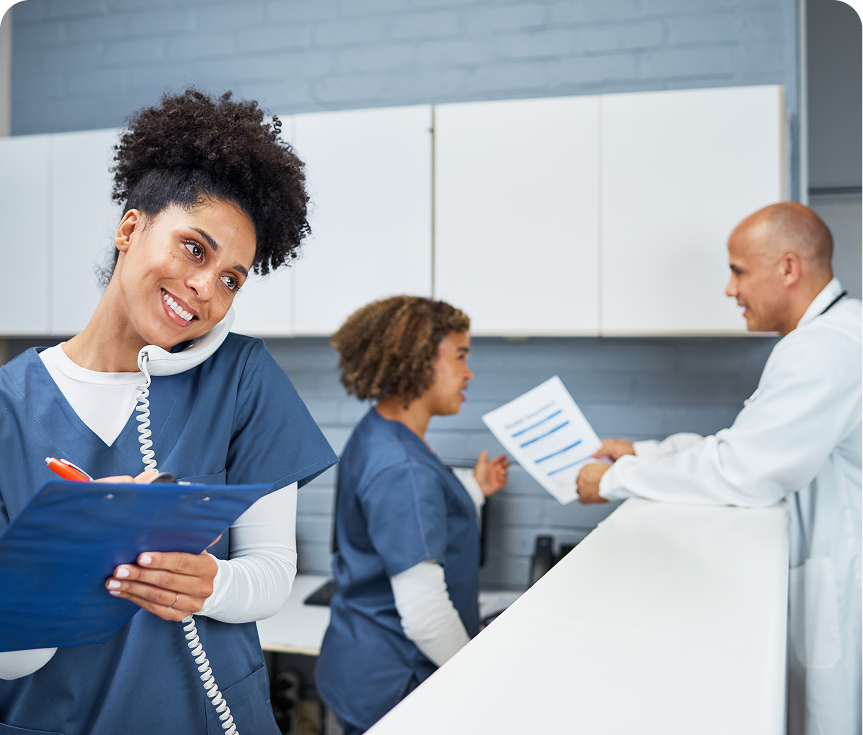 Healthcare team in discussion at reception