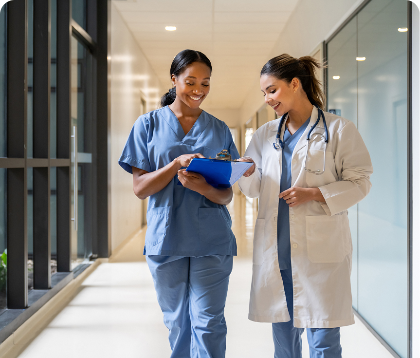 Healthcare workers reviewing clipboard together