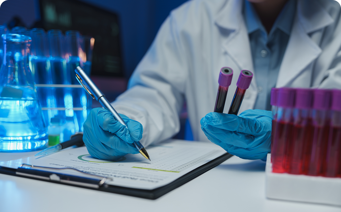 Researcher holding test tubes in laboratory